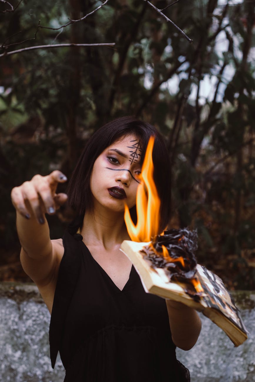 woman wears black sleeveless top